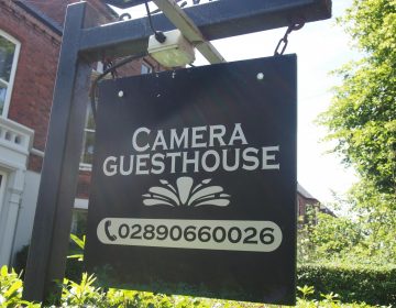 Camera Guest House Sign